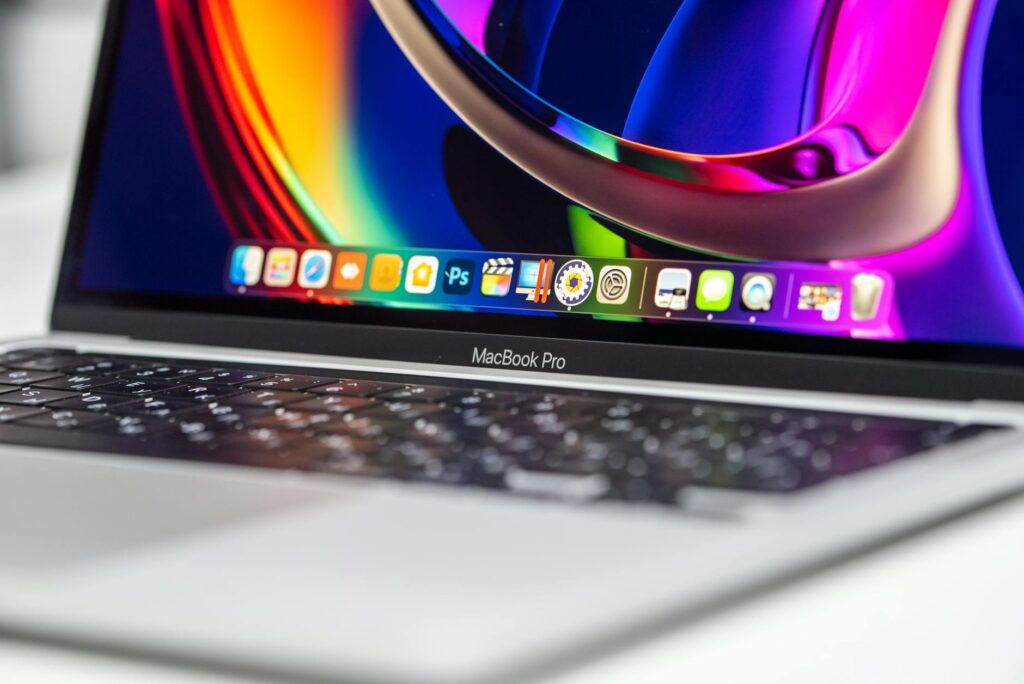 A vibrant close-up of a MacBook Pro showcasing its colorful screen and keyboard. (Photo by Aleksey Zemlyanoy on Pexels)