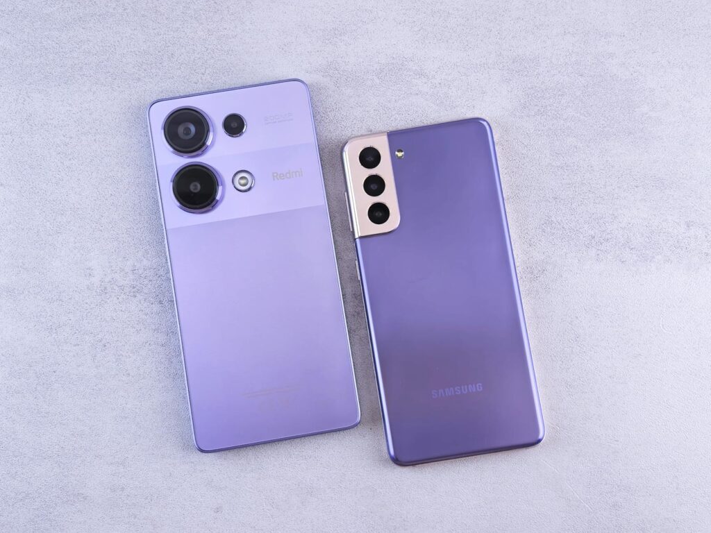 Detailed image showcasing two purple smartphones on a light surface. (Photo by Andrey Matveev on Pexels)