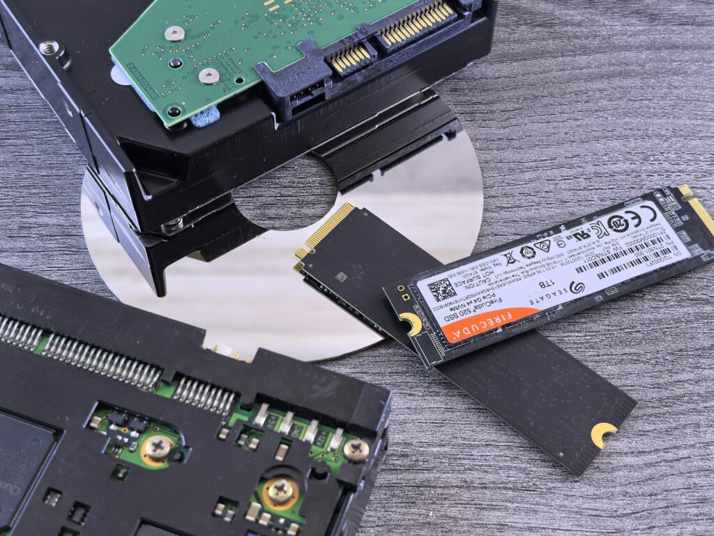 Contrasting data storage technologies: NVMe SSD, HDD, and CD. (Photo by Andrey Matveev on Pexels)