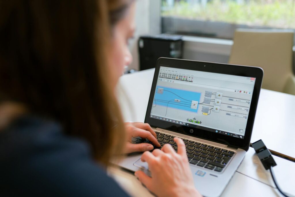 A woman engineer focuses on software analysis using a laptop indoors. (Photo by ThisIsEngineering on Pexels)